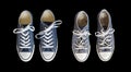 New and old blue sneakers isolated on black background Royalty Free Stock Photo