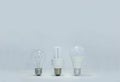 New and old tecnology Lightbulbs on white background