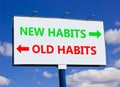 New or old habits symbol. Concept word New habits Old habits on beautiful billboard with two arrows. Beautiful blue sky with Royalty Free Stock Photo