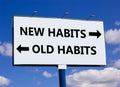 New or old habits symbol. Concept word New habits Old habits on beautiful billboard with two arrows. Beautiful blue sky with Royalty Free Stock Photo