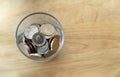 New one pound British sterling coin and penny and in glass bottle on wooden table, Concept financial business investment with Copy Royalty Free Stock Photo