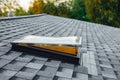 new open roof window on shingles flat polymeric roof-tiles