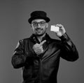 Pleasant fashionable man pointing at credit card in his hand Royalty Free Stock Photo