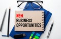 New Opportunities text on notepad, concept background Royalty Free Stock Photo
