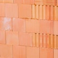 New orange brick wall background. House building worker concept. Royalty Free Stock Photo