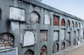 New Orleans, ancient cemetery, wall of niches, tombs, bricked up, some with plaques