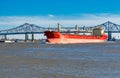 New Orleans, LA - February 8, 2016: Oil tanker passes under a bridge Royalty Free Stock Photo