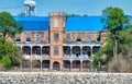 New Orleans, LA - February 11, 2016: A rustic abandoned warehouse on the shoreline as viewed on a boat while traveling along the Royalty Free Stock Photo