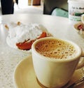 New Orleans, LA - USA - 03-20-2024: Chicory coffee and beignets at Cafe Du Monde in the French Quarter Royalty Free Stock Photo