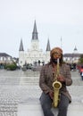 NEW ORLEANS,LA/USA -03-17-2019: A musician plays jazz on the saxophone in front of St Louis Cathedral in New Orleans French