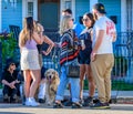 Group of Friends and a Golden Retriever Gathered in the Neighborhood During Poboy Fest