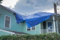 Blue Tarp on Roof of Damaged Home From Hurricane Ida Royalty Free Stock Photo