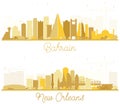 New Orleans Louisiana and Bahrain City Skyline Silhouette with Golden Buildings Isolated on White