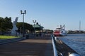 View of the Mississippi river from the city of New Orleans riverfront, with a Mississippi Steamboat on the background, in New Orle