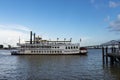 View of the Mississippi river from the city of New Orleans riverfront, with a Mississippi Steamboat Creole Queen and the Great Ne