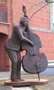 New Orleans, Louisiana, U.S.A - February 4, 2020 - Statue of a bass fiddle player near French Market Royalty Free Stock Photo