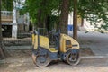 Hydrostatic vibratory roller parked on street