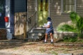 Mail Carrier Delivering Mail in Uptown New Orleans Royalty Free Stock Photo