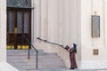 Nun Praying on the Steps of Catholic Church in New Orleans