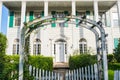 Large White House with Arbor, Trellis and White Picket Gate Royalty Free Stock Photo