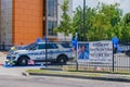 Police Car and Banner Honoring Officer, who Died from Corona Virus