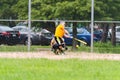 Softball Batter Swinging at Pitch and Missing