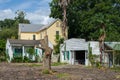 Two Abandoned Buildings Slated for Demolition and One Occupied House