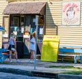 Two girls ordering snowballs at Williams Plum Street Snowballs stand in Carrollton neigh