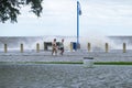 Two men walking along flooded Lakeshore Drive