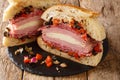 New Orleans original Muffaletta sandwich close up on a slate board. Horizontal Royalty Free Stock Photo