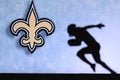 New Orleans Saints. Silhouette of professional american football player. Logo of NFL club in background, edit space Royalty Free Stock Photo