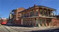 New Orleans streetcar and wrought iron balcony Royalty Free Stock Photo