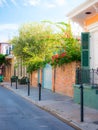 New Orleans, USA - April 22, 2018: Row houses of traditional architecture in Louisiana city on street sidewalk at French Quarter Royalty Free Stock Photo