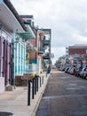 New Orleans, USA. December 2019. Row houses of traditional architecture in Louisiana city on street sidewalk at French Quarter Royalty Free Stock Photo