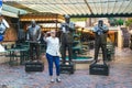 New Orleans - 04/16/2018 : woman with stick selfie and famous jazz man statues