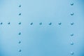 New painted blue matt metal rivets on iron sheet Royalty Free Stock Photo