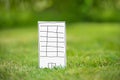New paper highrise tower in grass Royalty Free Stock Photo