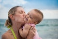 New Parents Play with Baby on the Beach