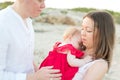 New parents with sleeping baby outdoors Royalty Free Stock Photo