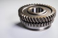 New parts on a gray background. Gears of gear shifting torque transmission. Conceptually mechanical background. Shiny Royalty Free Stock Photo
