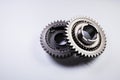 New parts on a gray background. Gears of gear shifting torque transmission. Conceptually mechanical background. Shiny Royalty Free Stock Photo