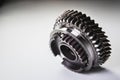 New parts on a gray background. Gears of gear shifting torque transmission. Conceptually mechanical background. Shiny Royalty Free Stock Photo