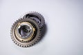 New parts on a gray background. Gears of gear shifting torque transmission. Conceptually mechanical background. Shiny Royalty Free Stock Photo