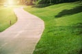 New pathway and beautiful trees track for running or walking and cycling relax in the park on green grass field on the side of the Royalty Free Stock Photo