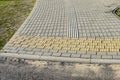 New paved walkway with guidelines for visually impaired people