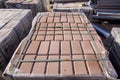 New paving stone tiles folded and packed on a pallet. Royalty Free Stock Photo