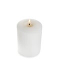 New pillar wax candle burning on white background Royalty Free Stock Photo