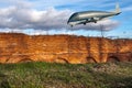 New plane over an ancient wall