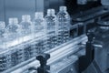 The new plastic bottles in the conveyor belt Royalty Free Stock Photo