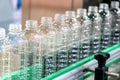 The new plastic bottles on the conveyor belt . Royalty Free Stock Photo